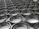 Camera lens captive bezel caps