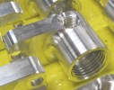 Breakout adapters for tapered pipe thread fittings